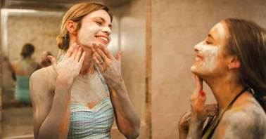 A person looking at a mirror with white powder on her face

AI-generated content may be incorrect.