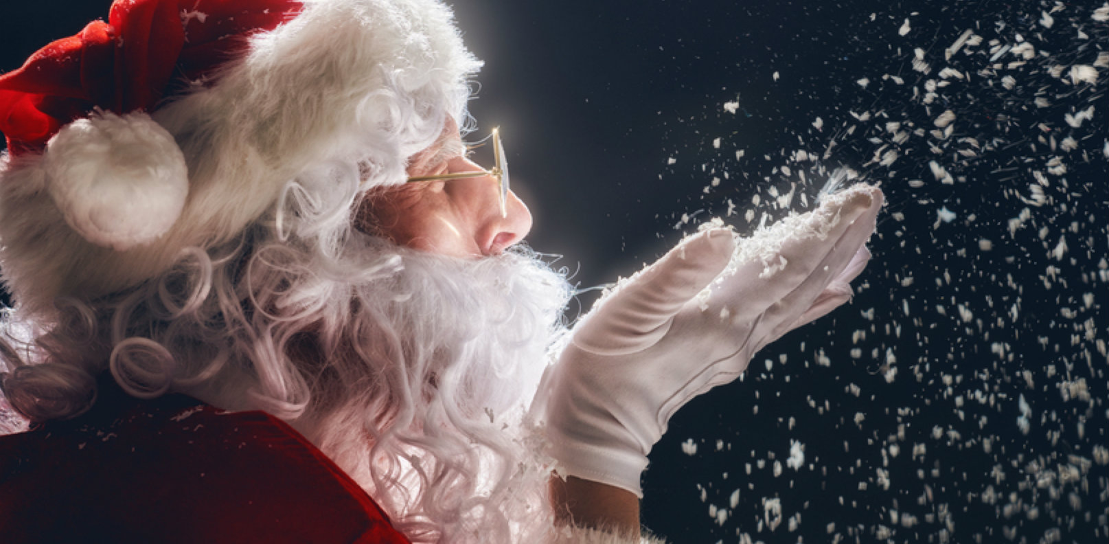 Santa blowing snow